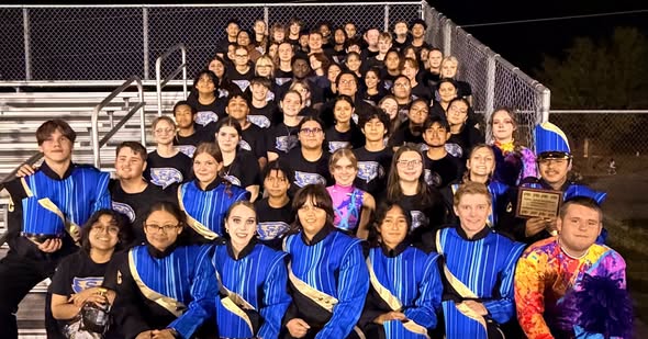Shelbyville Central Golden Eagles Marching Band with their award